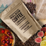 Brown bag of Amaretto Decaf coffee beans from Maldon Coffee Company.