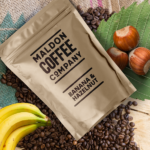 Brown sealed bag of banana and hazelnut coffee beans from Maldon Coffee Company.
