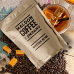 Brown sealed bag of Butter Rum coffee beans from Maldon Coffee Company.