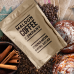 Brown bag of Cinnamon Swirl Decaf Coffee from Maldon Coffee Company.