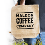 Beige tote bag with the Maldon Coffee Company logo in black.