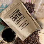 Brown bag of Maldon Coffee Company Roma coffee beans.